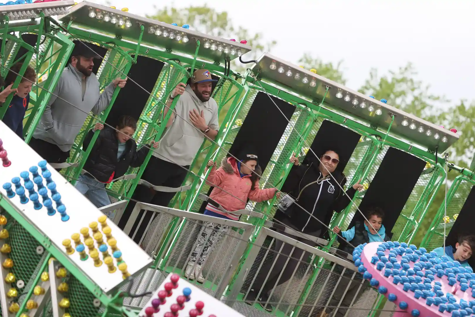 Families enjoying a midway ride at the Schomberg Fair