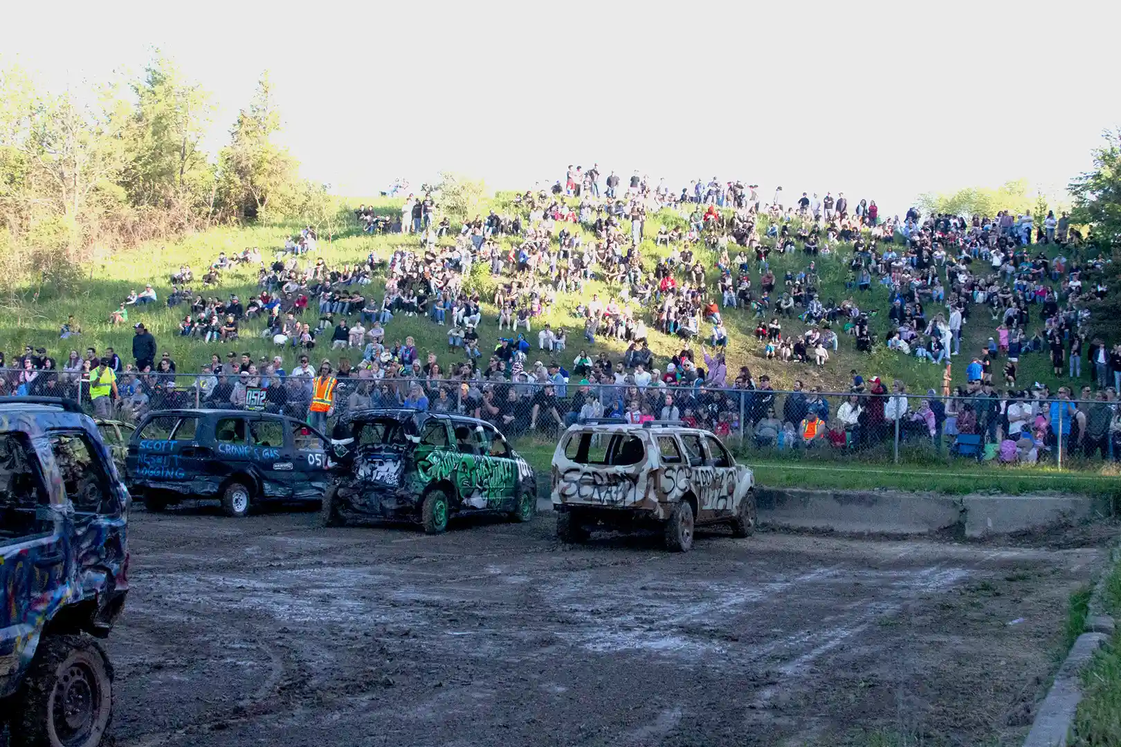 Packed hillside crowd watching the Demolition Derby at the 2026 Schomberg Agricultural Fair